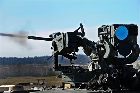 A U.S. soldier fires an MK-19 grenade launcher during a live-fire exercise on the Grafenwoehr ...