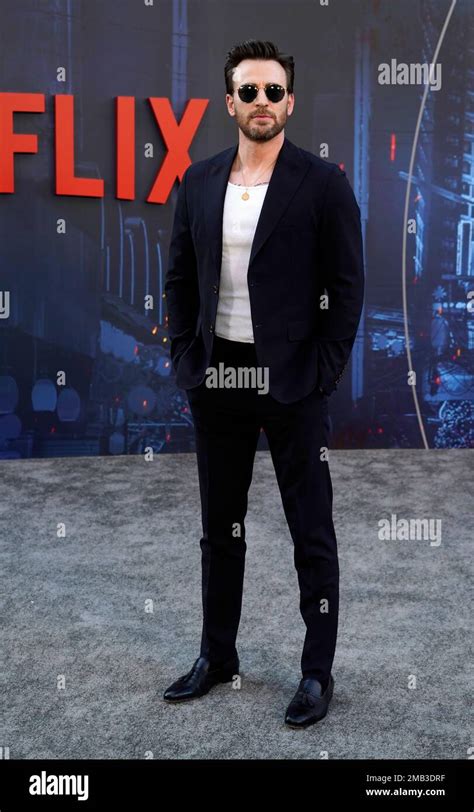 Chris Evans, a cast member in "The Gray Man," poses at the premiere of the Netflix film ...