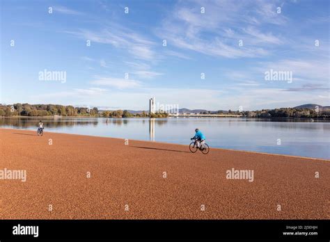 Cycling around Lake Burley Griffin in Canberra city centre on a sunny ...