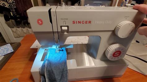 singer heavy-duty 44S sewing machine. I love this machine. And a small sewing room and house ...