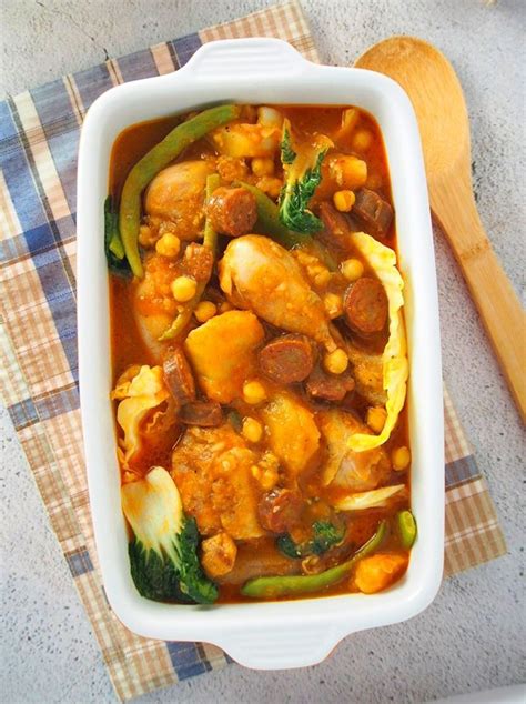 Chicken Pochero is the perfect Sunday lunch! Loaded with vegetables, beans, smoked sausage, and ...