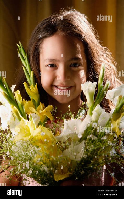 little girl smiling over bouquet of flowers Stock Photo - Alamy