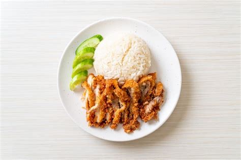 Premium Photo | Hainanese chicken rice with fried chicken or rice ...