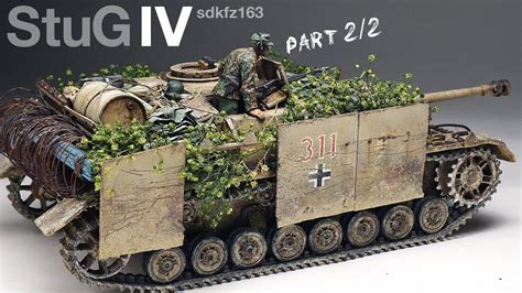 a toy army tank with plants growing out of it's sides and soldiers in ...