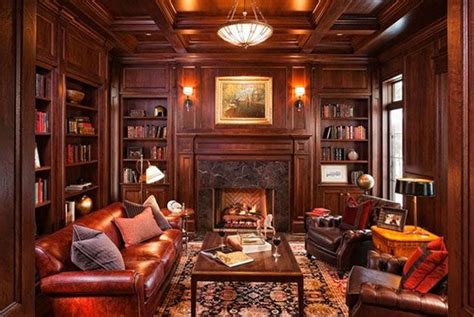 Warm den with rich wood paneling and fireplace. #den #study ...