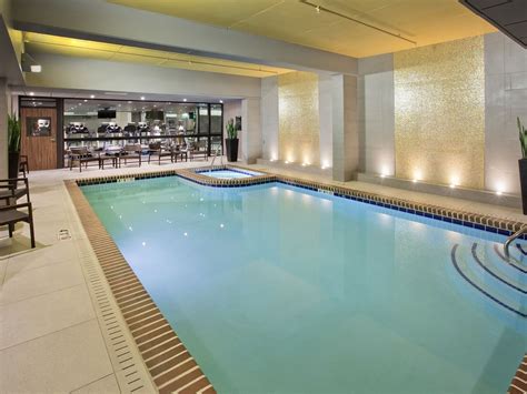 Indoor Swimming Pool with sun loungers at Warwick Seattle