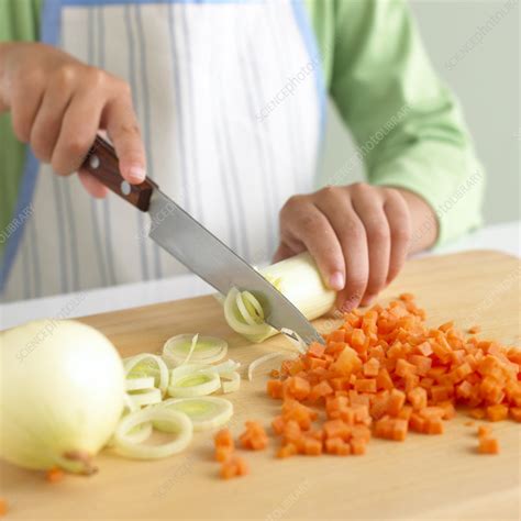 Chopping vegetables - Stock Image - C051/3883 - Science Photo Library