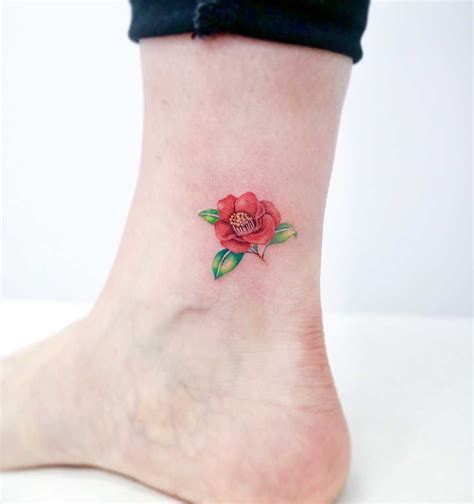 Camellia flower by tattooist Nemo - Tattoogrid.net