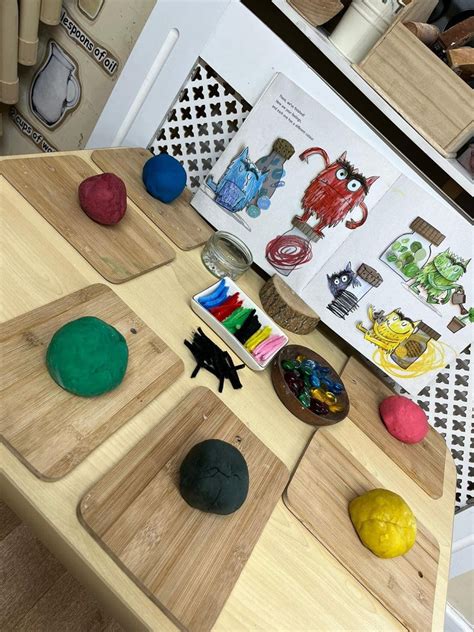 the table is made out of wood and has different colored objects on it