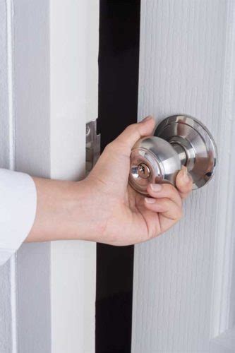 bigstock-Hand-Opening-Door-Knob-On-Whit-178640803 - Construction Specifier