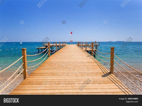 Wooden Pier On Beach Image & Photo (Free Trial) | Bigstock