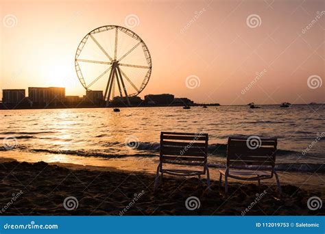 Two Sunbeds with Ain Dubai Ferris Wheel View at JBR Beach Stock Image ...