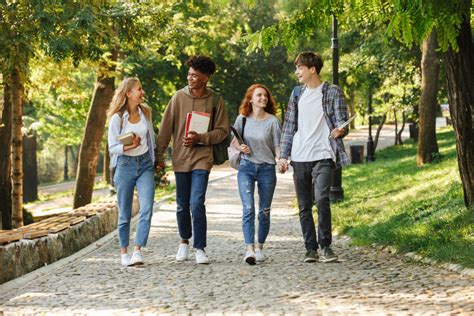 Group of happy student walking at the campus outdoors | My College Corner