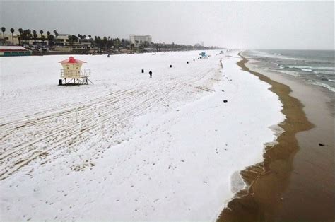 Rare snow on Huntington Beach plus waterspouts near Los Angeles — Earth ...