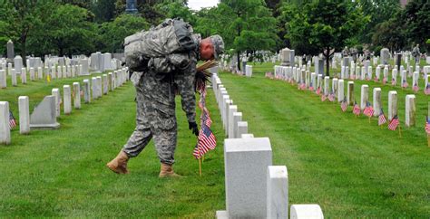 Soldiers participate during Flags In at Arlington Cemetery | Article ...