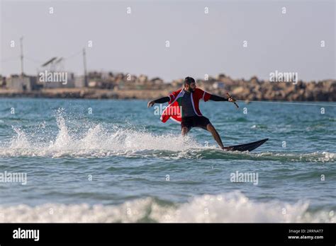 221230 -- GAZA CITY, Dec. 30, 2022 -- A Palestinian surfer dressed in ...