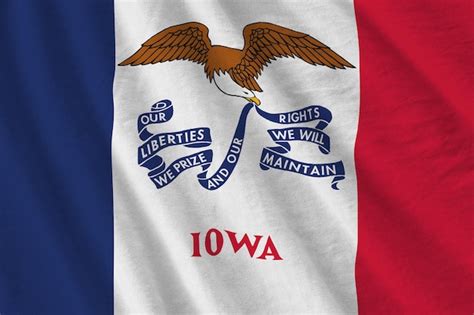 Premium Photo | Iowa us state flag with big folds waving close up under ...