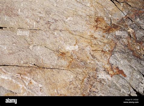 tan and gray quartzite rock background texture with cracks Stock Photo - Alamy