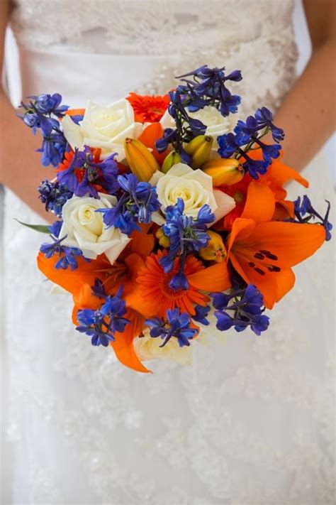 my bridal bouquet - blue and orange for Mets colors - daisies, lilies, roses and delphinium ...