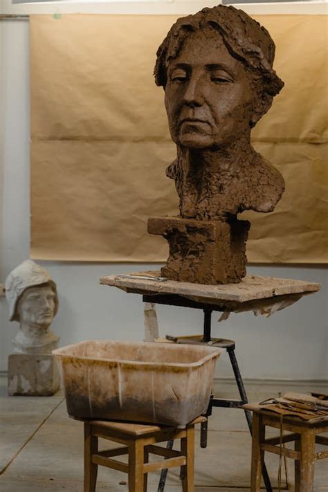 Brown Concrete Man's Head Sculpture · Free Stock Photo