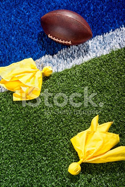 Penalty Flags Around A Football AT The End Stock Photos - FreeImages.com