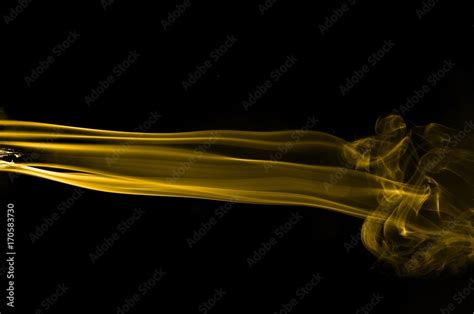 Gold smoke on black background,movement of gold smoke, Abstract gold ...