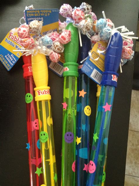 Party Favors! In lieu of a bag of random junk, 99 cent bubble wands with Dum Dums stuck in the ...