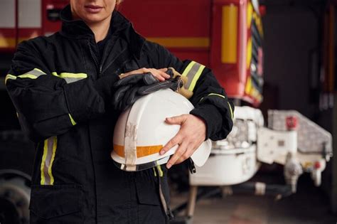 Premium Photo | Woman firefighter in uniform is at work in department