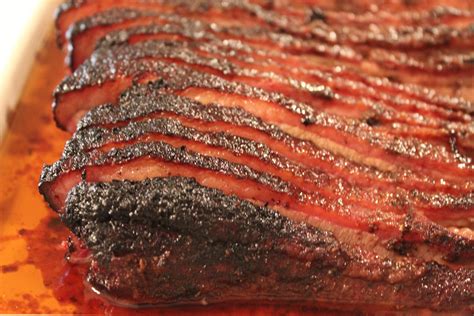 Dry Rubbed Smoked Brisket is slow cooked on a smoker, then wet mopped ...