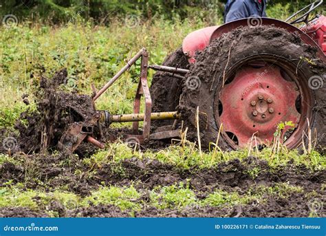 Tractor stuck in mud stock image. Image of boggy, weed - 100226171