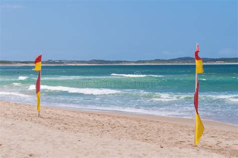 Red and Yellow Flags on Patrolled Beach Indicating Safe To Swim Area Stock Photo - Image of ...