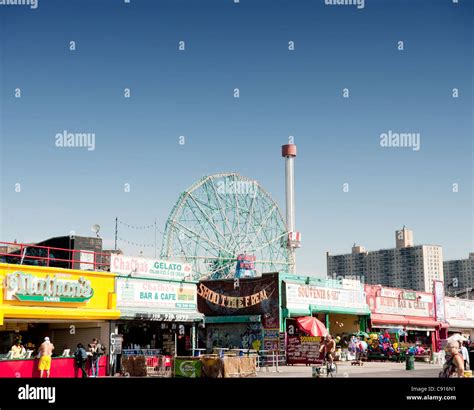 Coney Island is famous for its amusements boardwalk seaside cafes and fairground attractions and ...