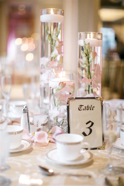 Floating Candle Centerpieces with Blush Orchids and Rose Gold Table ...