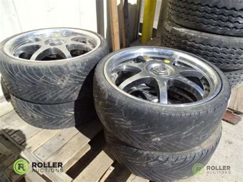 (4) Hankook K106 215/35R18 Tires With Motegi 8-Lug Rims - Roller Auctions