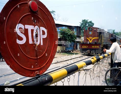 stop sign railway crossing India Stock Photo - Alamy