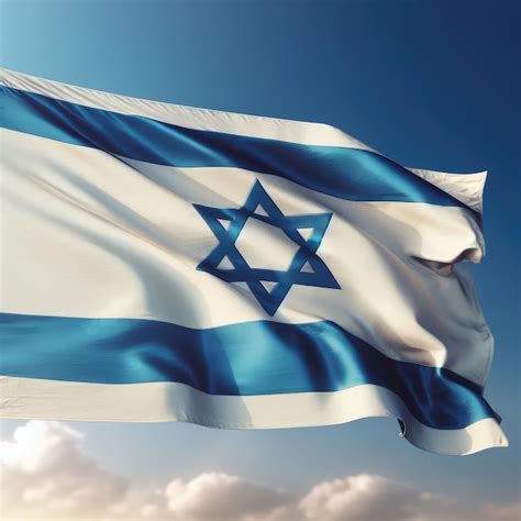 Premium Photo | Israeli flag on cloudy blue sky background