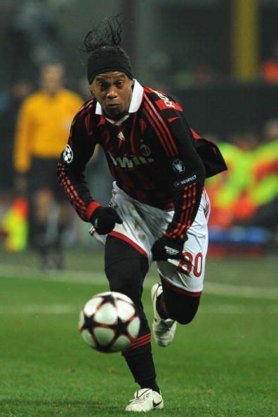 Ronaldinho of AC Milan celebrates the opening goal during the UEFA ...