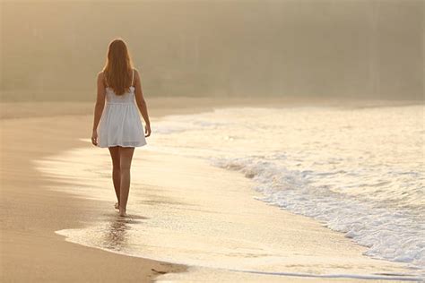 Royalty Free Girl Walking On Beach Alone Pictures, Images and Stock Photos - iStock