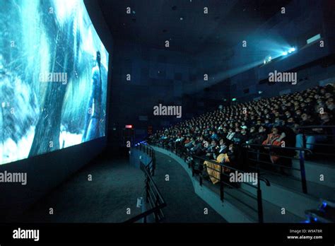 Local residents watch 3d IMAX version of the movie Avatar at the Peace ...