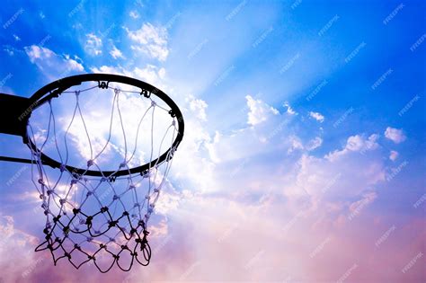 Premium Photo | Basketball hoop viewed from below on beautiful sky ...