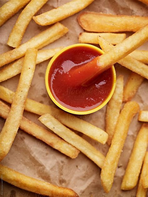 "French Fries And Ketchup" by Stocksy Contributor "B & J" - Stocksy