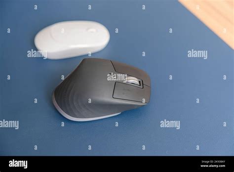 Comparison of Ergonomic vertical mouse and general mouse on desk at ...