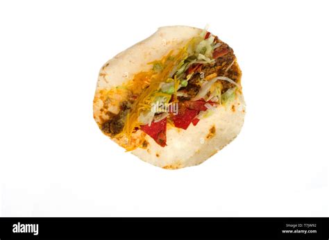 Taco Bell soft spicy loaded nacho taco open on white background Stock Photo - Alamy