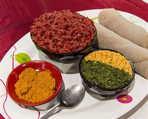 Ethiopian Kitfo - spice-marinated raw beef with extra spice, sides, and injera bread rolls : r ...