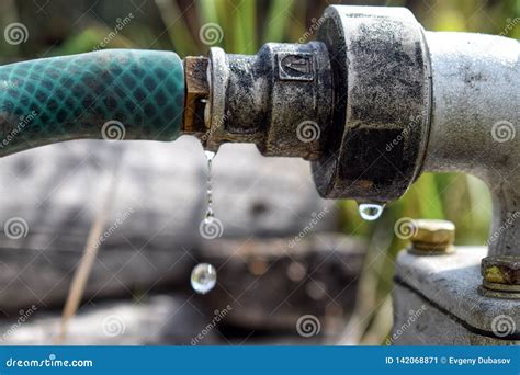 Falling Drop from Metal Pipe with Water Close Up Stock Image - Image of iron, faucet: 142068871