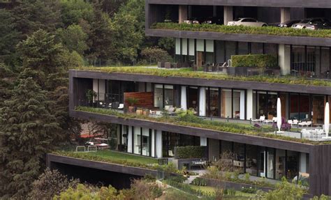 Modern apartment building twists for enviable green space | Terrace building, Apartment building ...