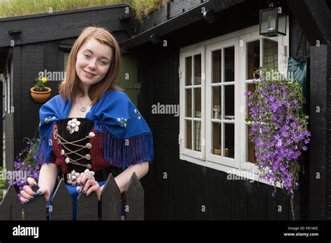 Faroese girl wearing tradition clothes in Tinganes, the historic area ...