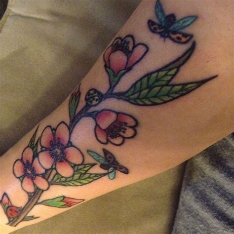 Peach blossom & ladybug inner forearm tattoo by Billy Darr, Alameda ...