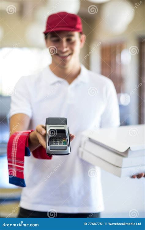 Happy Pizza Delivery Man Showing Credit Card Machine Stock Image - Image of offering, napkin ...