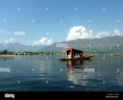 Shikara ride in Dal Lake, Srinagar, Kashmir, with distant view of House ...